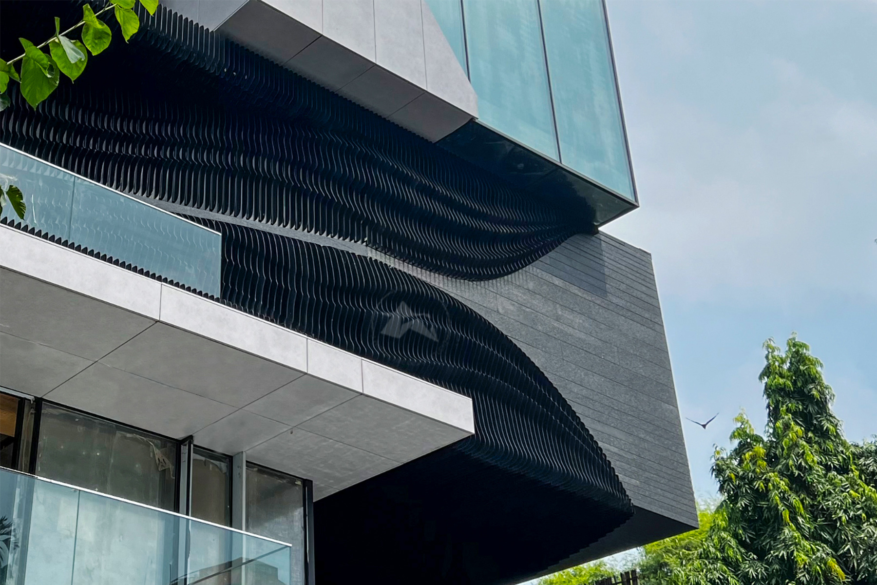 Sleek parametric metal facade for building by axes in excess